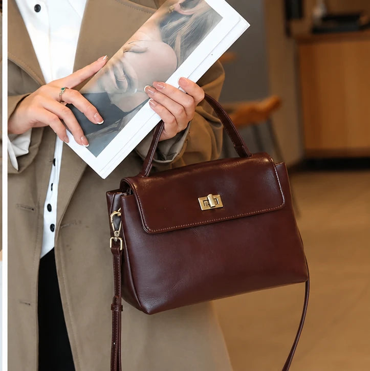 The Harlowe Satchel in burgundy oil-wax cowhide, worn crossbody — Maison Harlowe