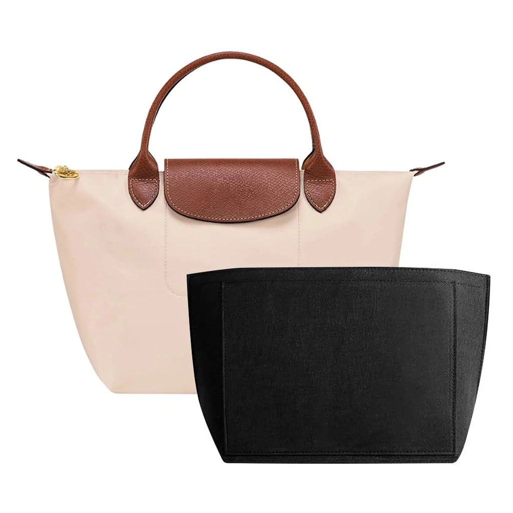 Felt organiser insert lifted out of a handbag, showing how it keeps its shape when removed